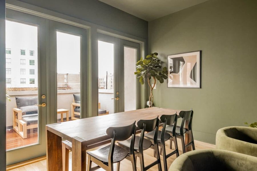 Dining area off the living room with views of the back terrace