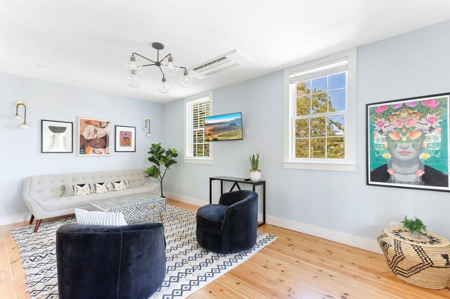 Professionally decorated & furnished living space with a sleeper sofa 