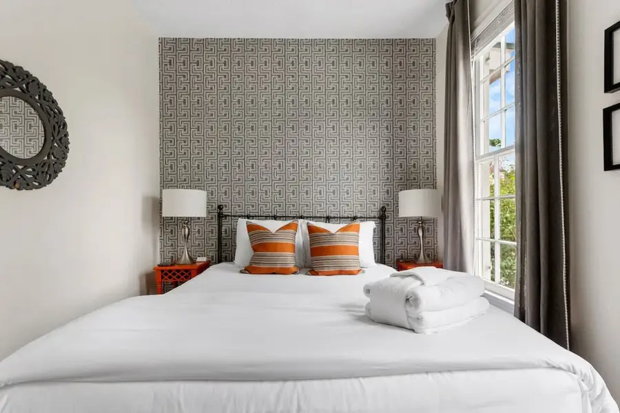 Bedroom 1: Queen Bed + TV + Ceiling Fan
