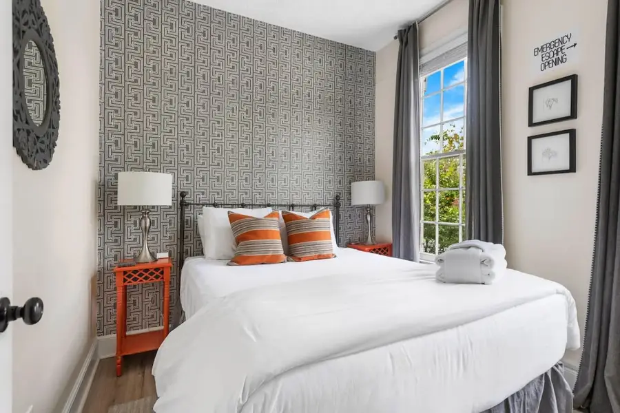 Bedroom 1: Queen Bed + TV + Ceiling Fan