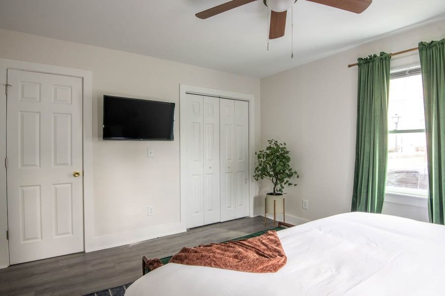 Bedroom 1: King Bed + TV + Ceiling Fan