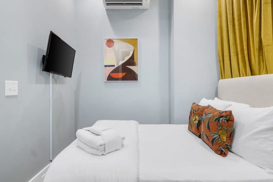Bedroom #2 with Full Bed, TV, and En-Suite full bathroom