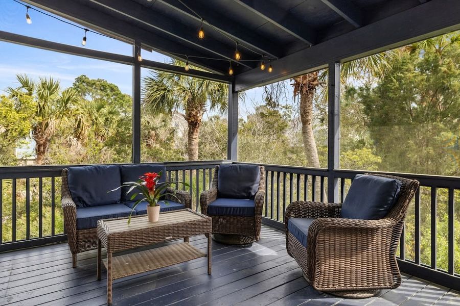 Additional outdoor seating in the screened in porch