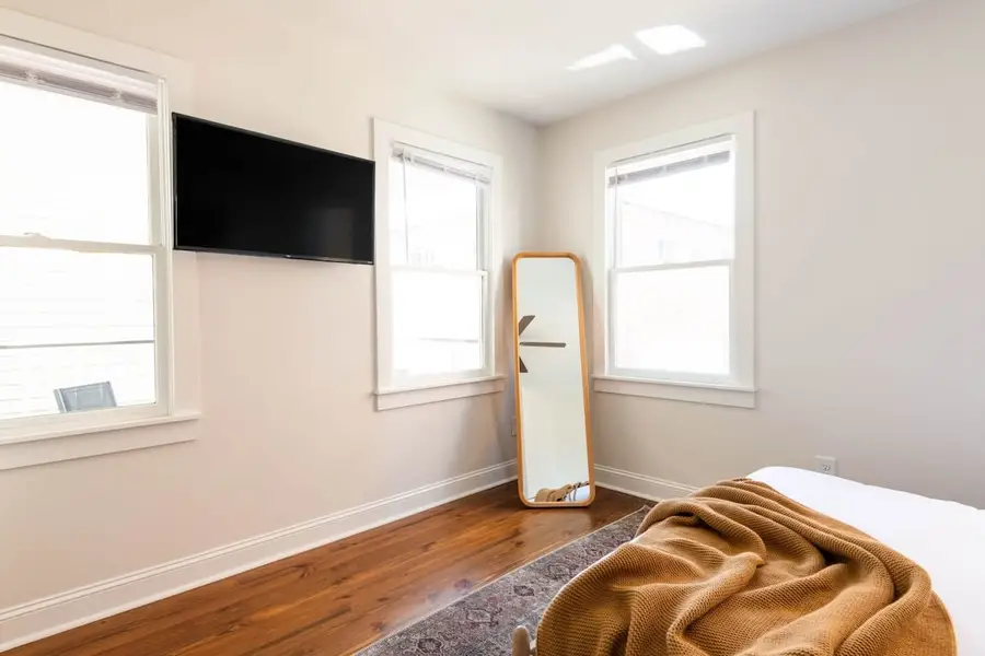 Bedroom 2: Queen Bed + TV + Ceiling Fan