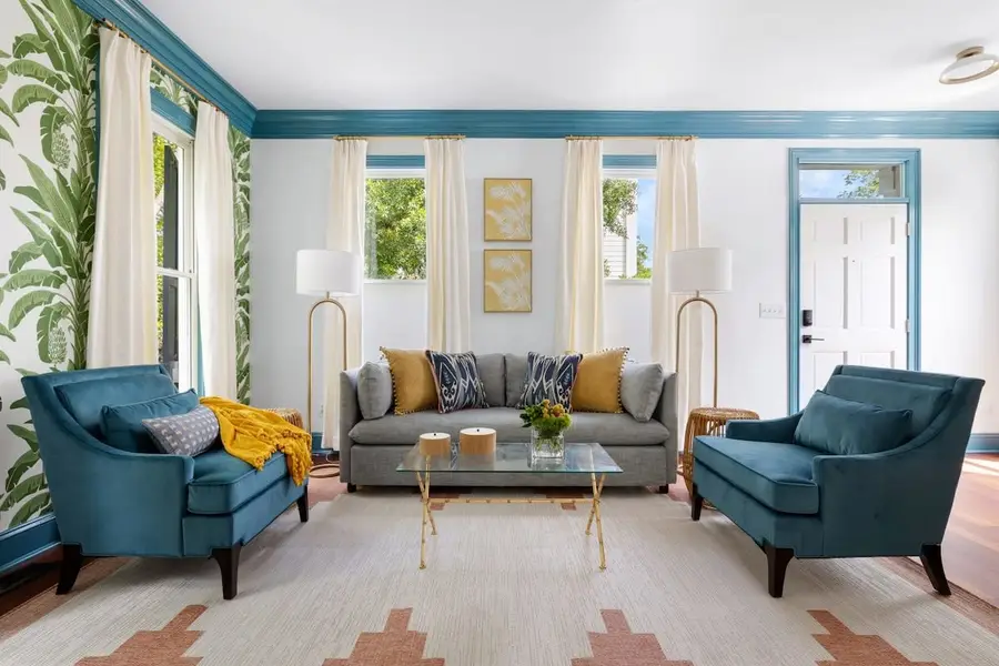 Spacious living room with plenty of seating + pullout sofa bed