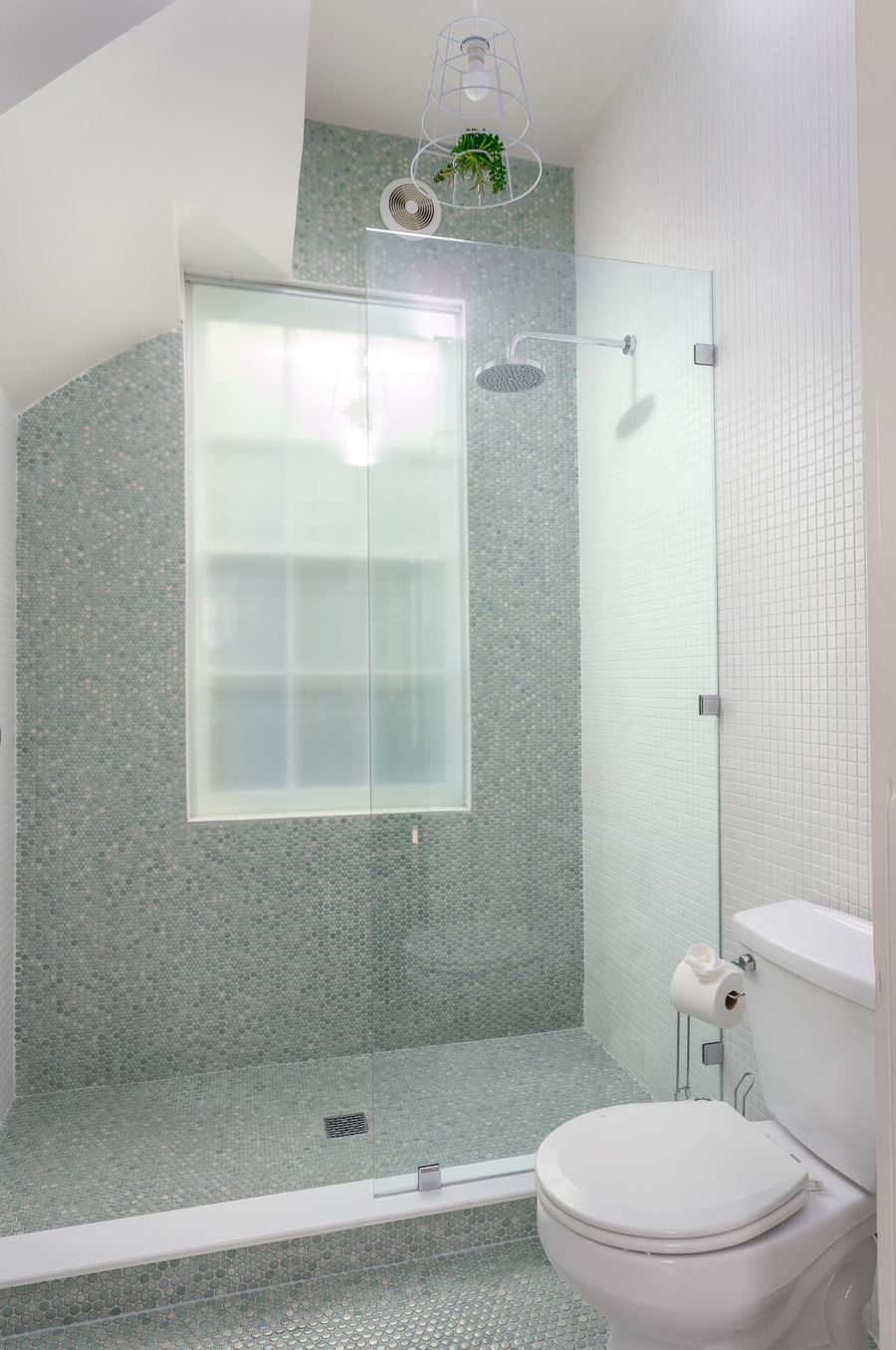 Second full bathroom with tile shower and rain head (off the living room next to pullout) 