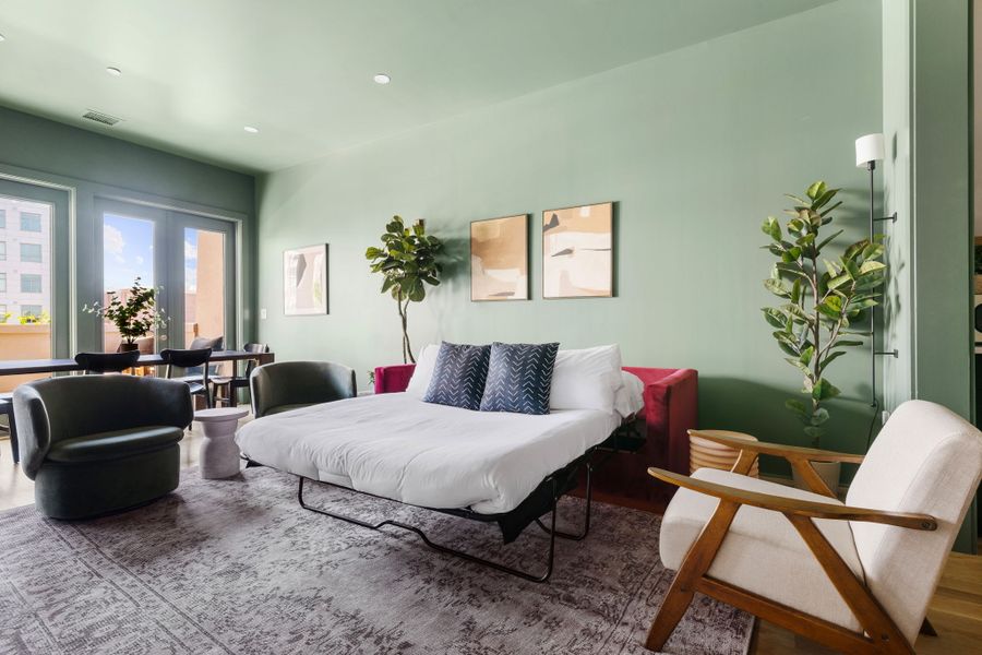 The living room has a pullout couch for additional sleeping space