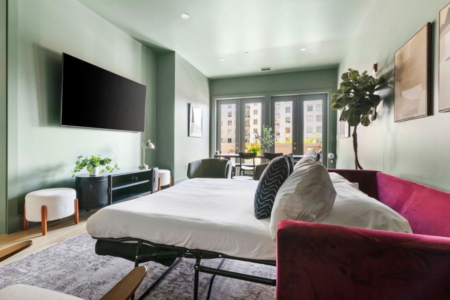 The living room has a pullout couch for additional sleeping space