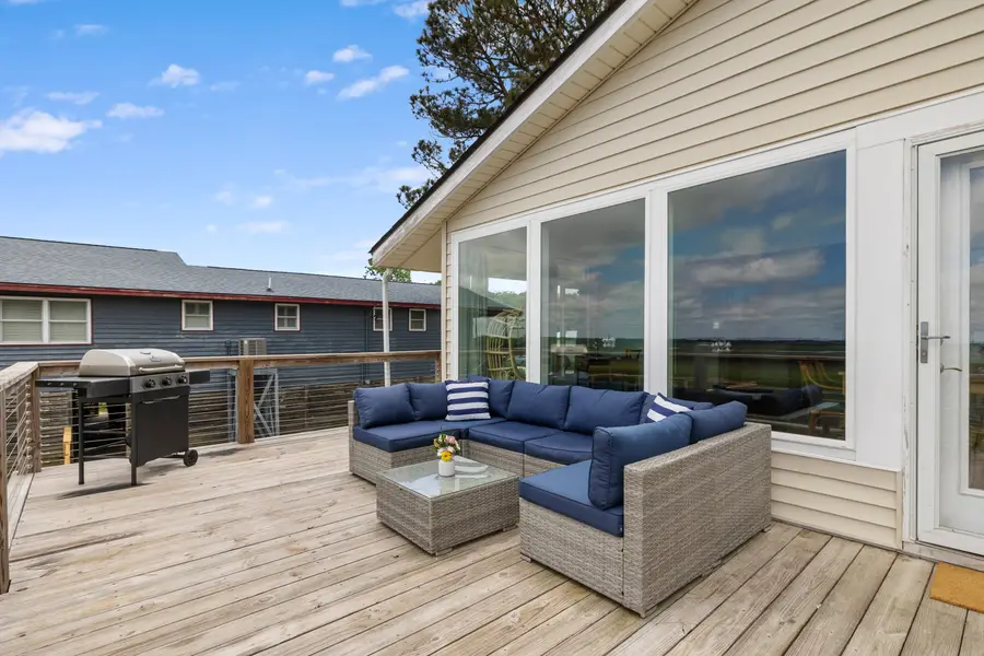 Large outdoor deck with seating and views of Folly Creek!