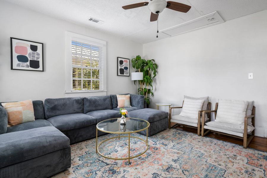 Spacious living room with a TV