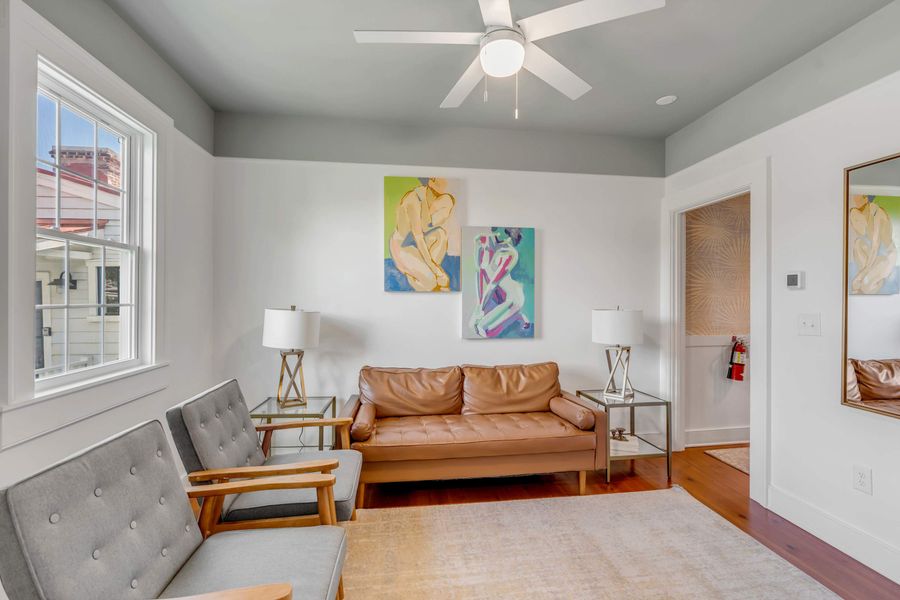 Additional living room with ample seating + TV