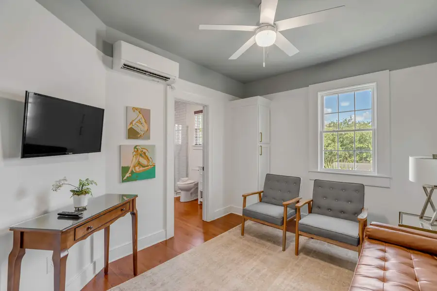 Additional living room with ample seating + TV