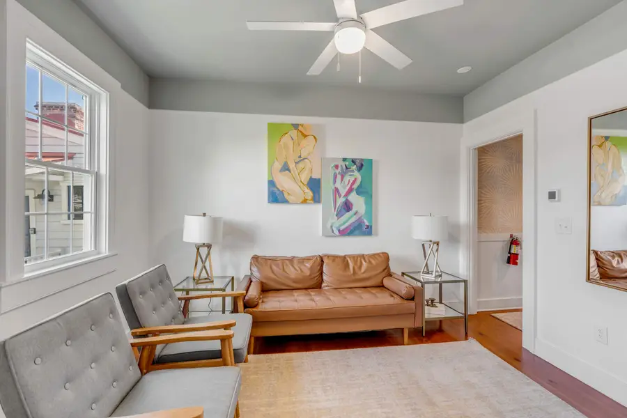 Additional living room with ample seating + TV