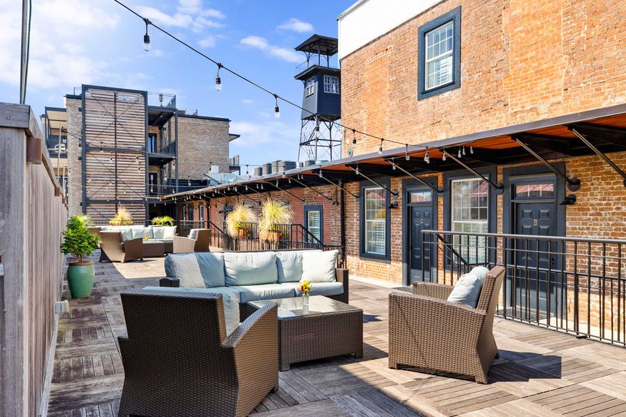 Shared terrace right outside your rental with seating for your group