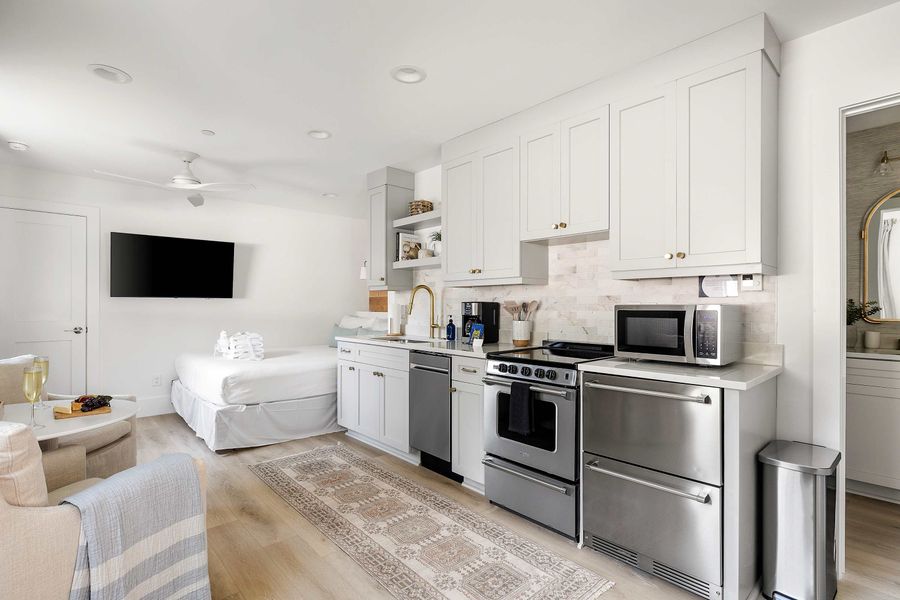 Welcome to your Folly Beach rental! Open layout bedroom with bathroom, kitchen and seating for two. 