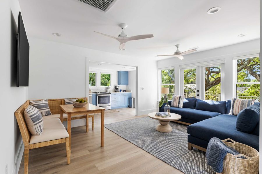 Spacious living room with seating for your entire group + TV and dining seating for four guests