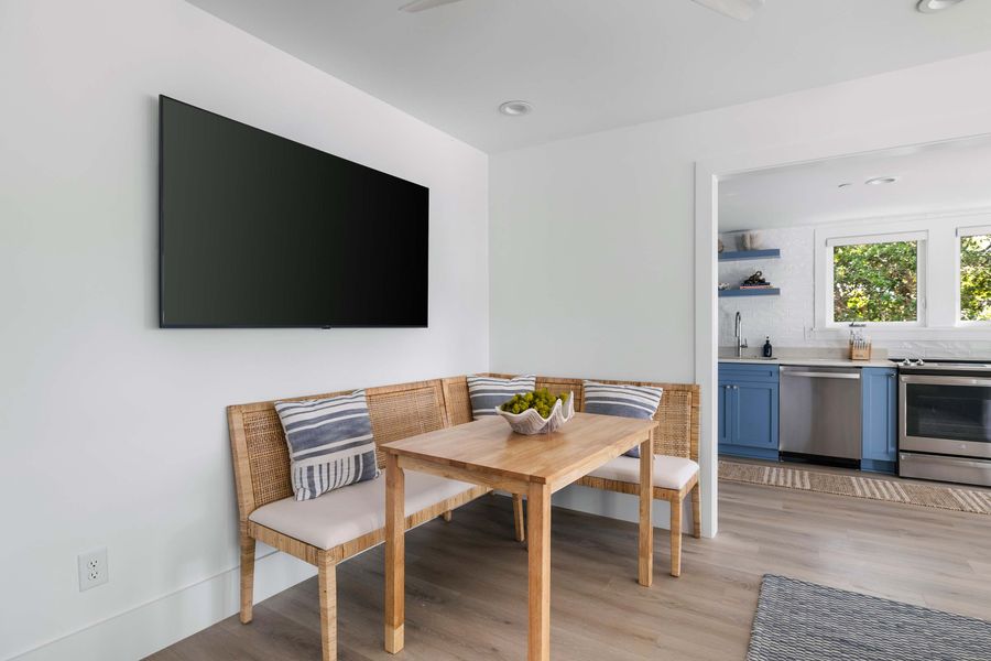 Dining seating for four guests + TV