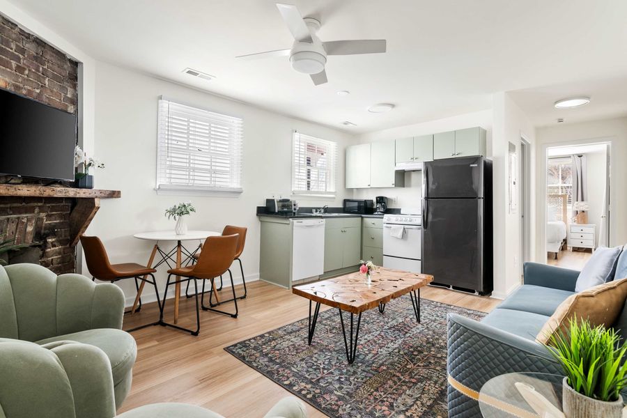 Open space layout featuring living room with plenty of seating space for your group, TV and dining and seating for three