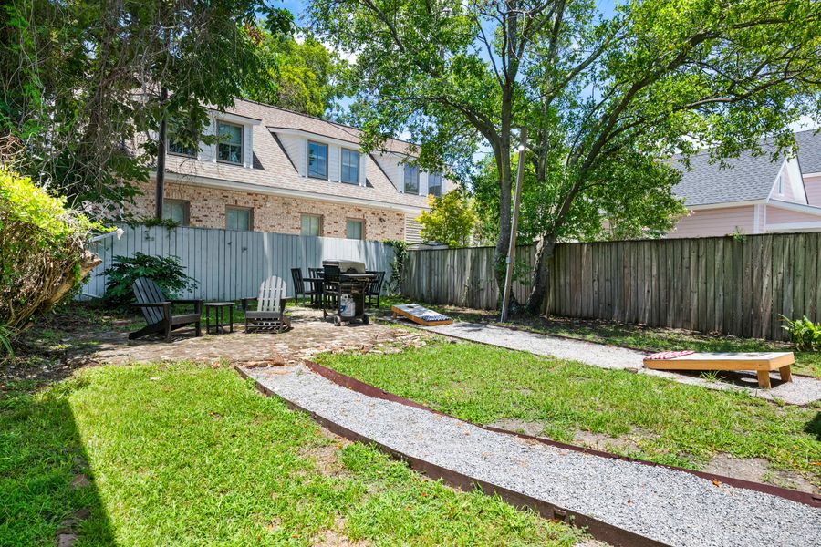 Backyard space with seating and a grill