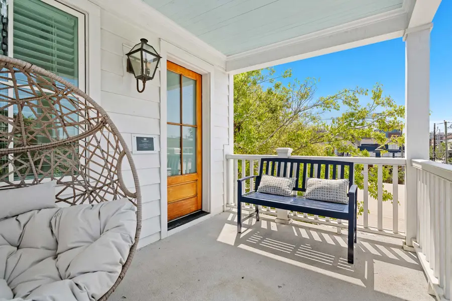 Outdoor seating space on top floor balcony