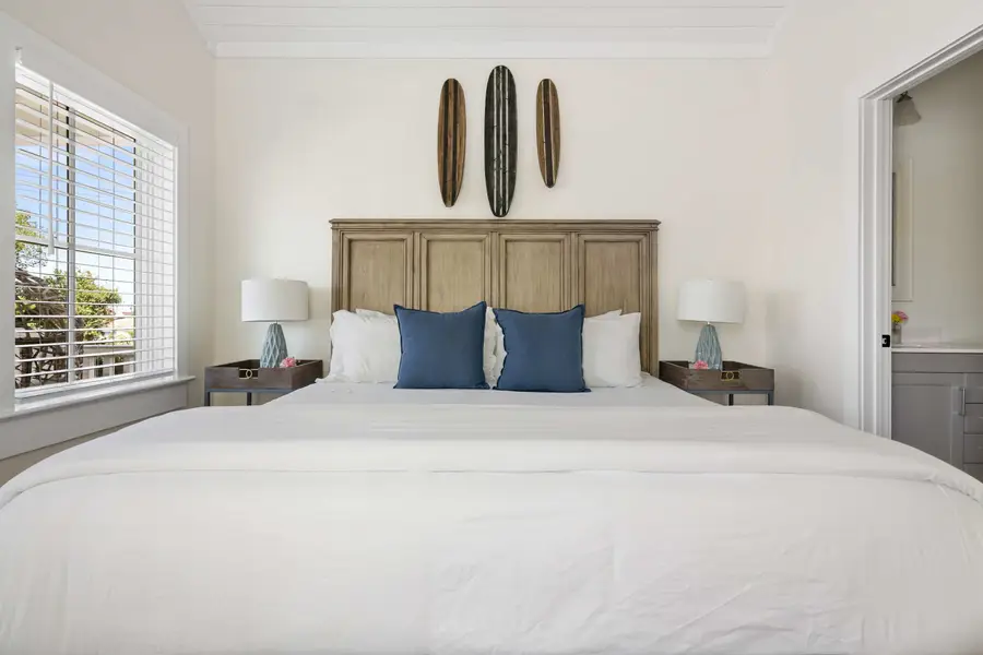Bedroom #1: King Bed + TV + Ceiling Fan + Balcony