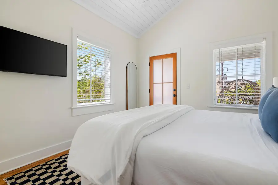 Bedroom #1: King Bed + TV + Ceiling Fan + Balcony