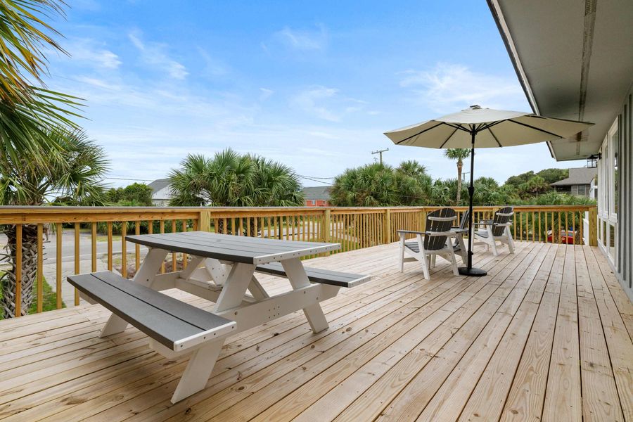 Large front porch with plenty of seating and ocean views! 