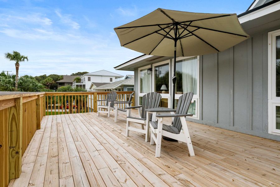 Large front porch with plenty of seating and ocean views! 