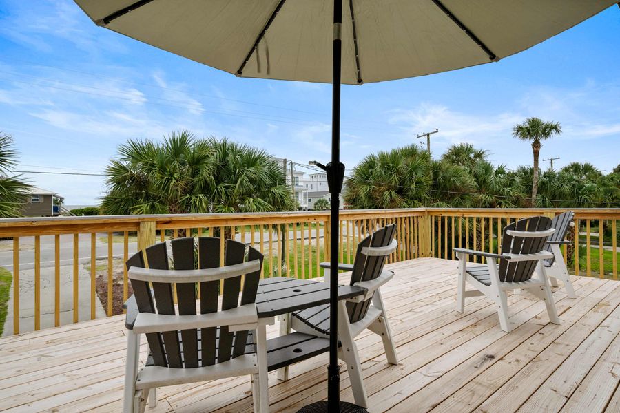 Large front porch with plenty of seating and ocean views! 