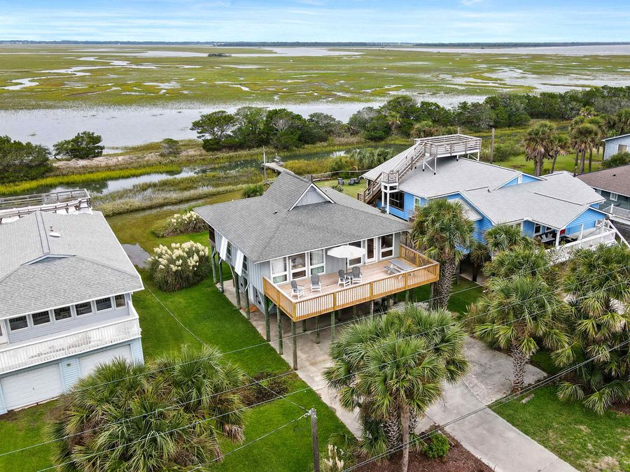 Aerial view of the home with the Folly Creek behind it. The beach is just across the street! 