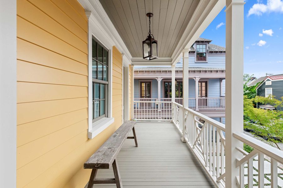 Second floor porch with bench