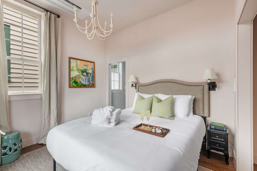Large bedrooms with plush linens and SMART TVs.