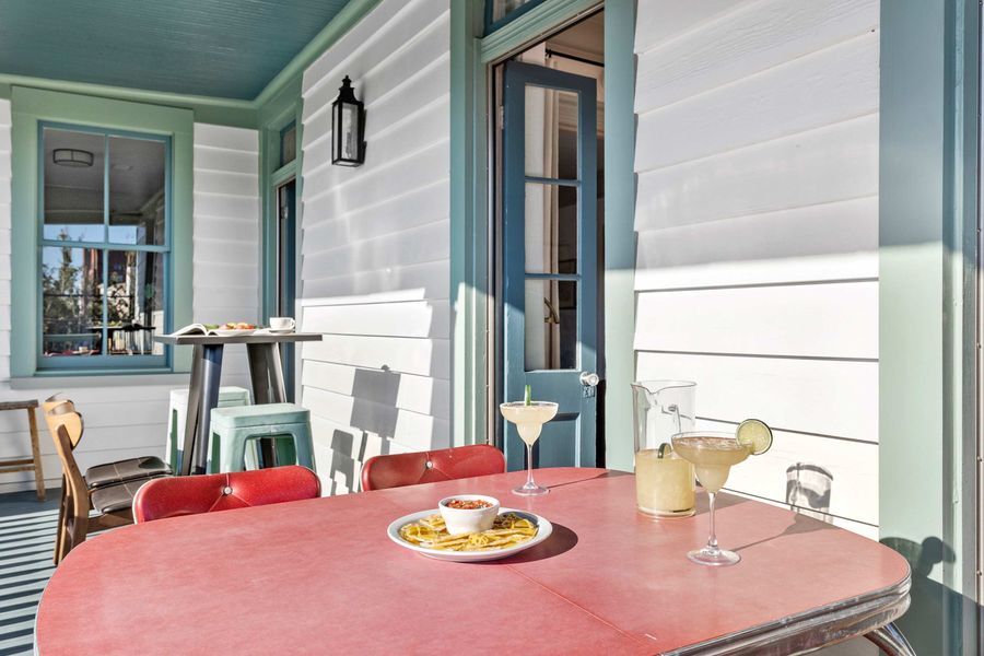 Second floor porch with dining and seating