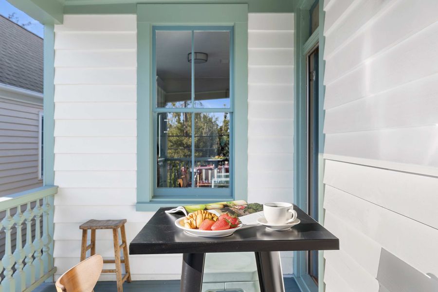 Second floor porch with dining and seating