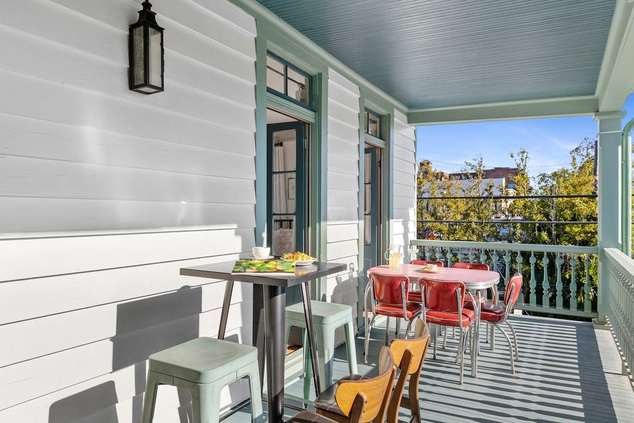 Second floor porch with dining and seating