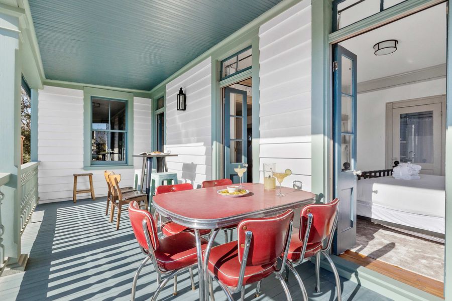 Second floor porch with dining and seating