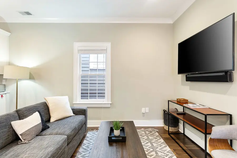 A welcoming living space with a TV and sleeper sofa for extra sleeping accommodations.