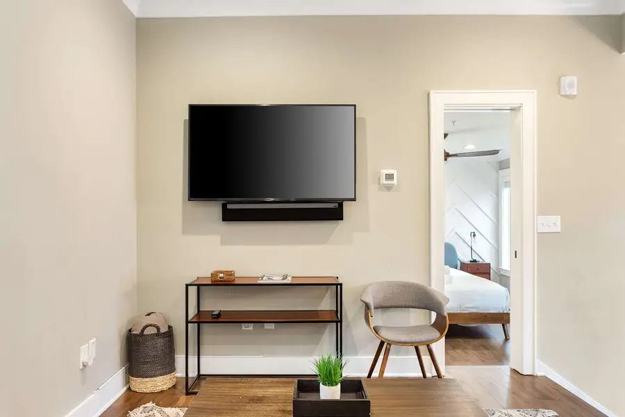 A welcoming living space with a TV and sleeper sofa for extra sleeping accommodations.