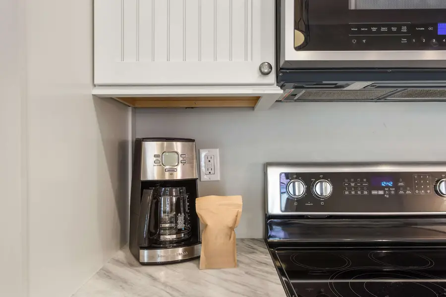 A fully stocked kitchen ready for everything from morning coffee to home-cooked meals.