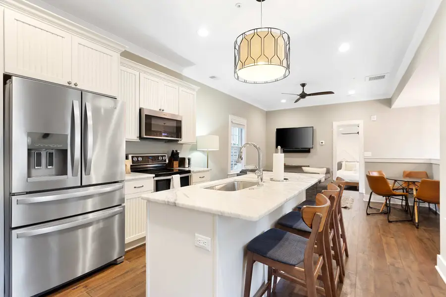 Kitchen island with bar seating for three, perfect for casual dining and conversation.