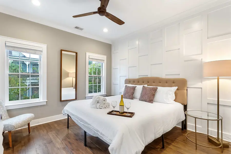 Bedroom 1: Relax in a king bed with natural light, a TV, and an attached private bath.