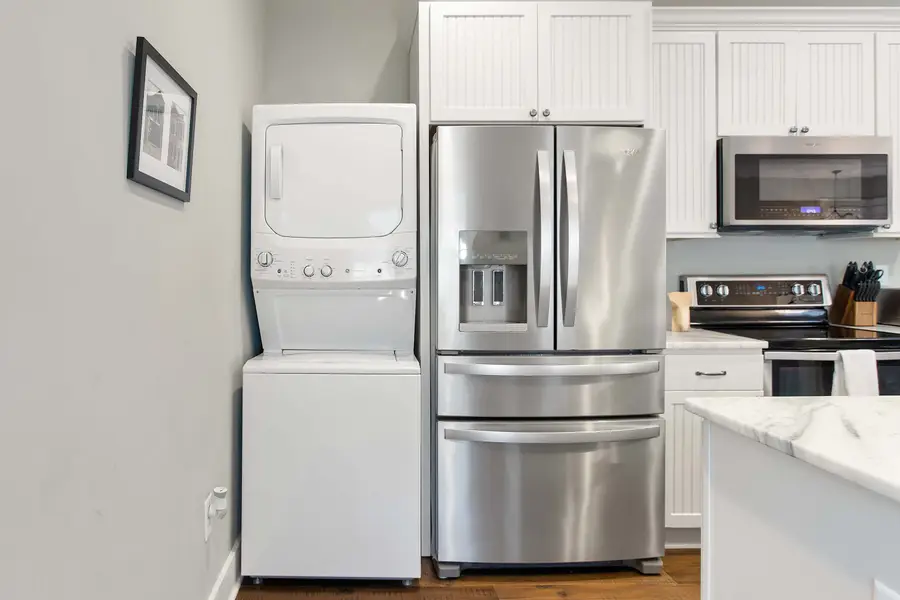 Convenient in-unit washer and dryer located just off the kitchen.