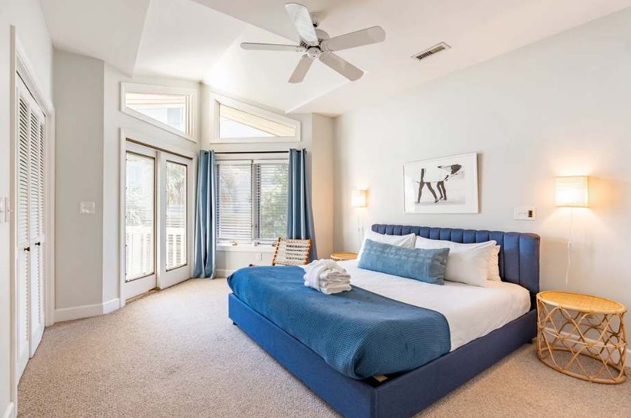 King bedroom with space, double closets, and large windows. 