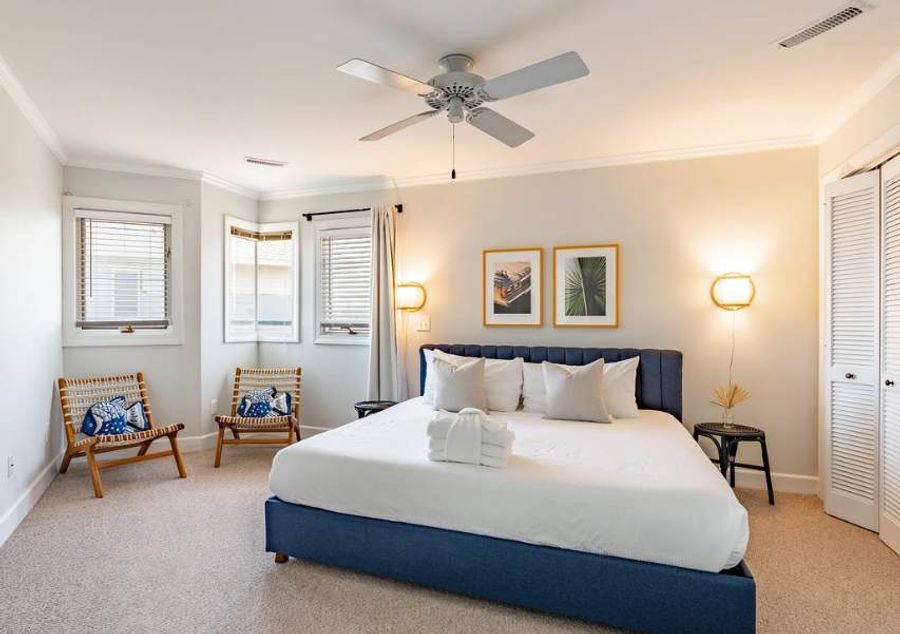 Wake up refreshed in a luxurious king bedroom, complete with soft bedding, generous space, and abundant natural light.