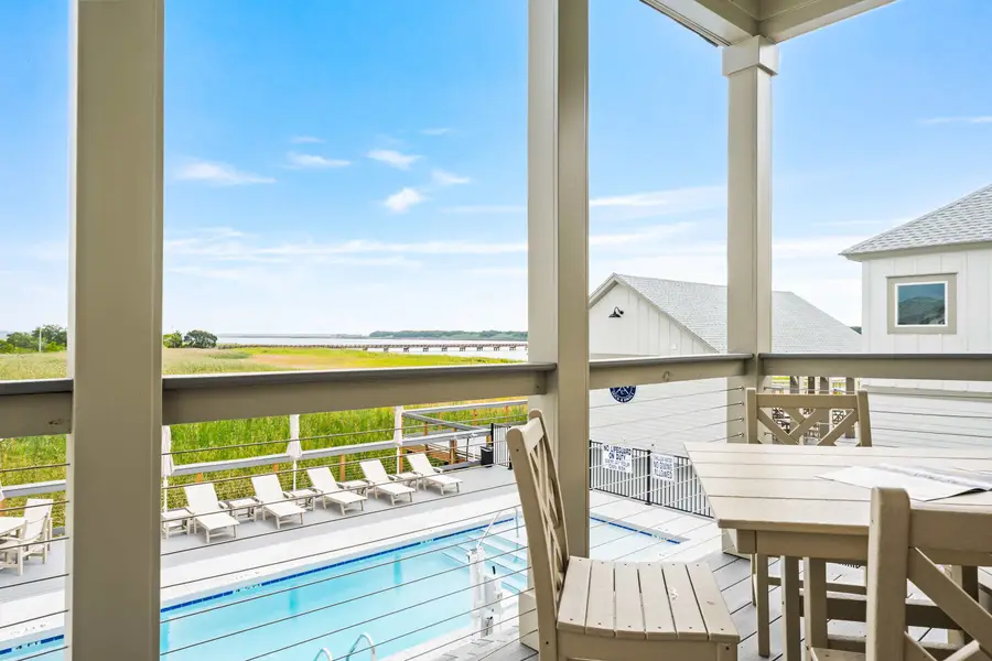 Balcony views of the Marsh and Pool. Steps away from all of the fun! 