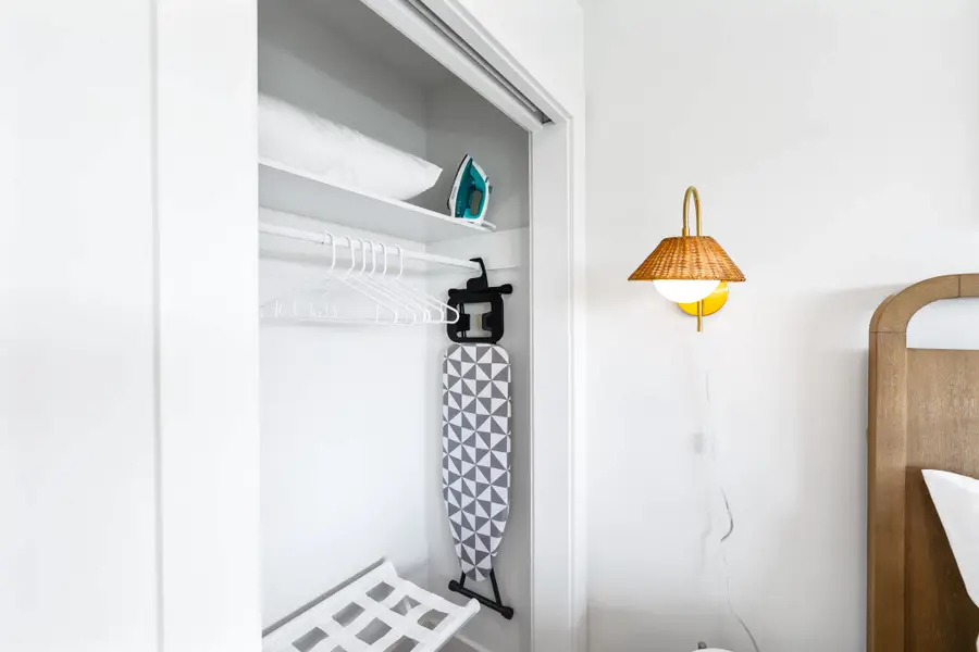 Storage with iron + ironing board