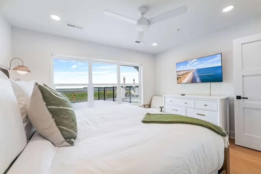 Bedroom 1: King Bed + TV + ceiling fan