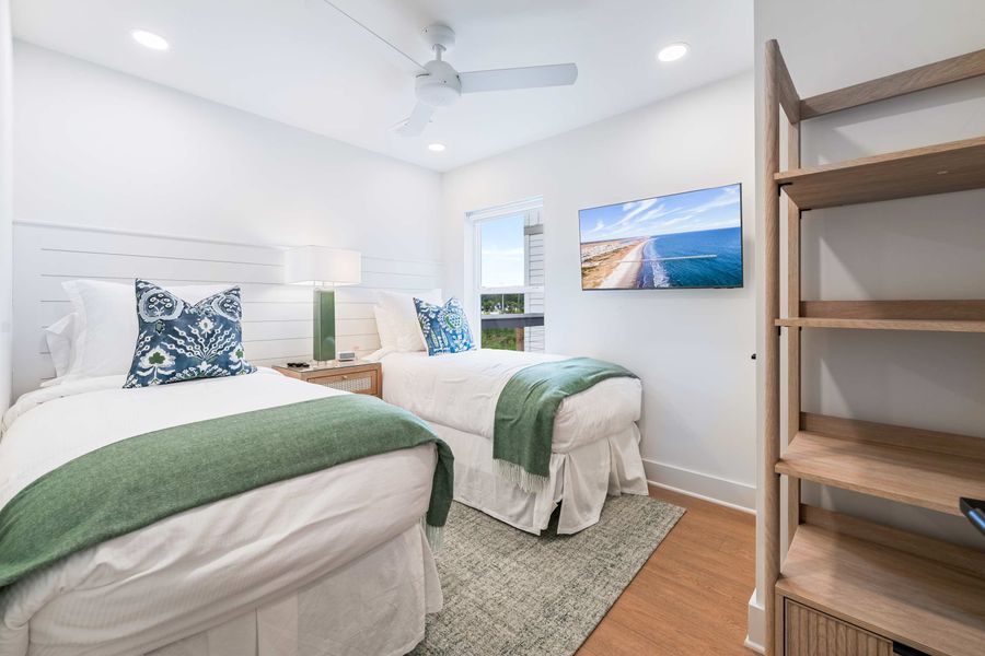 Bedroom 2: Two Twin Beds - (Can be converted to a King Bed on request) + ceiling fan