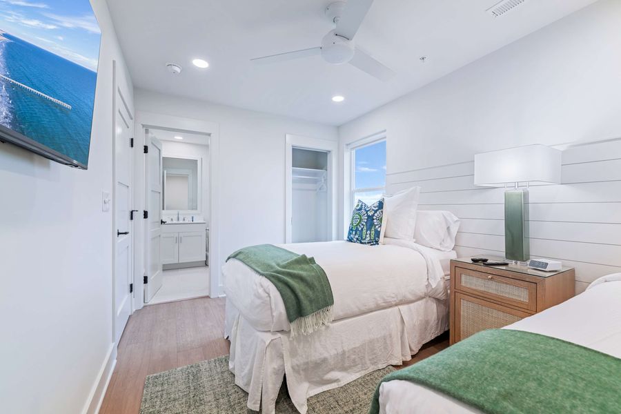 Bedroom 2: Two Twin Beds (can be converted to a King Bed) + TV 