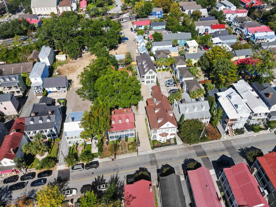 Aerial view that shows both houses on the property. There are 18 total bedrooms and 14.5 bathrooms between them both. 